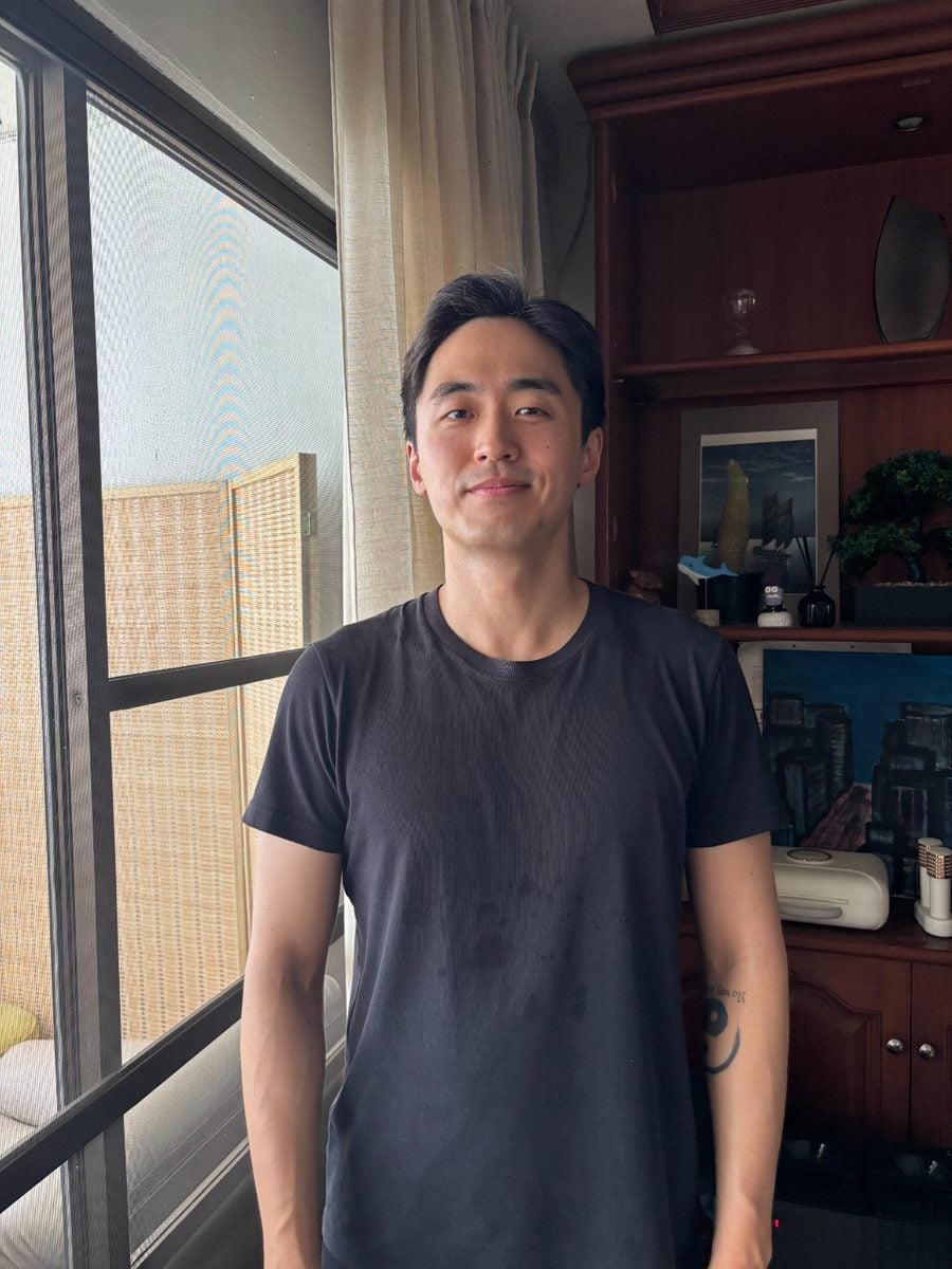 Example training photo, facing the camera with a closed-mouth smirk